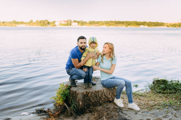 istock Parents play in the park with their son 1155214622