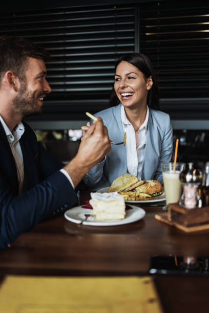 istock Attractive middle age man and woman in modern restaurant 1155215378