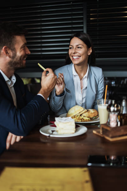 istock Attractive middle age man and woman in modern restaurant 1155215396