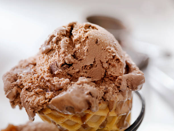 istock Double Chocolate Chunk Ice Cream in a Waffle Cone 1155216823