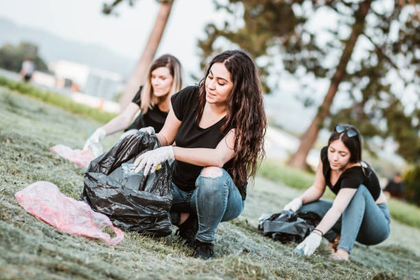 istock Girls with garbage bag doing plogging 1155217283