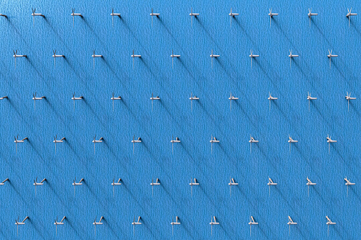 3D rendering of an aerial view of wind turbines in the ocean