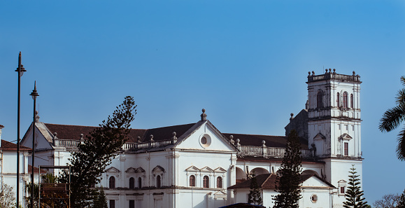 Exterior of a white historical cathedral, world heritage site in india. Church in old portugal colony.