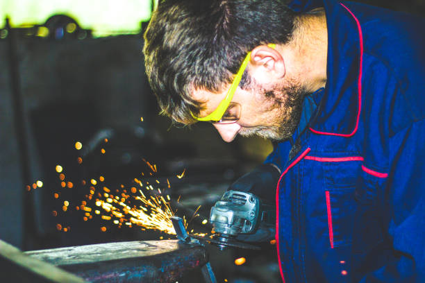 istock Worker Use Electric Grinder Cutting Metal 1155219387