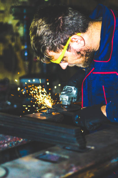 istock Worker Use Electric Grinder Cutting Metal 1155219390