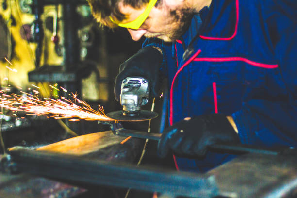 istock Worker Use Electric Grinder Cutting Metal 1155219425