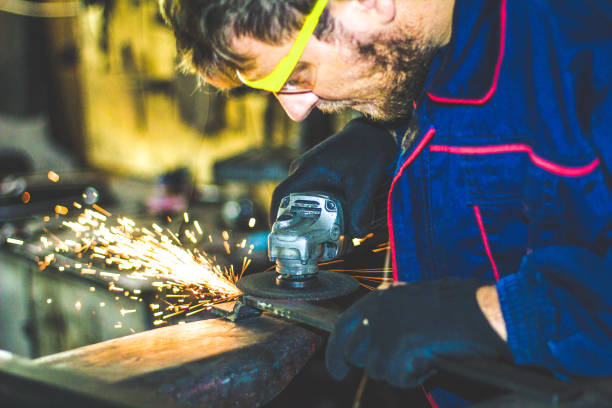 istock Worker Use Electric Grinder Cutting Metal 1155219474