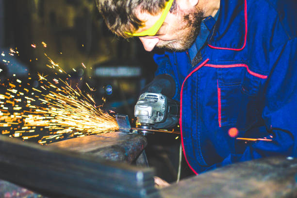 istock Worker Use Electric Grinder Cutting Metal 1155219532