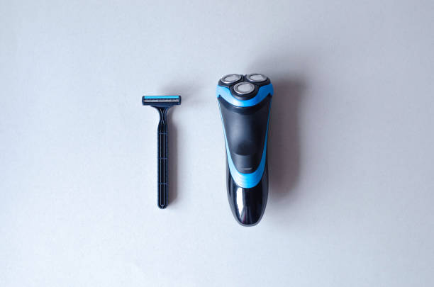istock Male machine and machine for shaving on a gray background. 1155220841