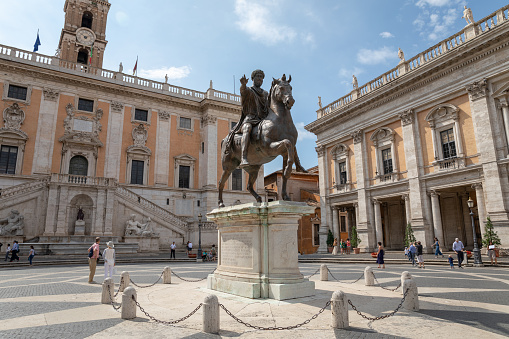 Rome, Italy - June 23, 2018: Panoramic view of Capitolium or Capitoline Hill is one of Seven Hills of Rome and Equestrian Statue of Marcus Aurelius is an ancient Roman statue on piazza del Campidoglio