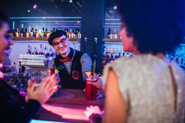 Handsome bartender making cocktails in the nightclub