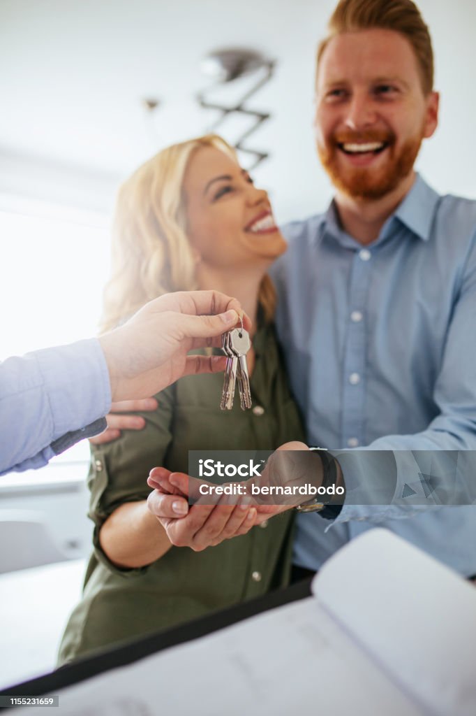 Our new home Happy couple moving in a new house. Home Ownership Stock Photo