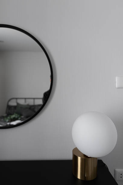 istock Black and white luxury feel dressing table corner in modern scandinavian style with gold circular lamp decorated / interior design concept / scandinavian interior 1155232210