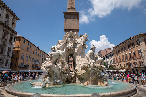 Rome, Italy - June 21, 2018: Closeup view of Fontana dei Quattro Fiumi (Fountain of the Four Rivers) is fountain in Piazza Navona in Rome. It was designed in 1651 by Gian Lorenzo Bernini