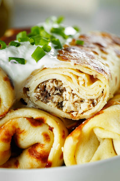 istock Thin pancakes with fillings. Russian Fried Stuffed Pancakes 1155233453