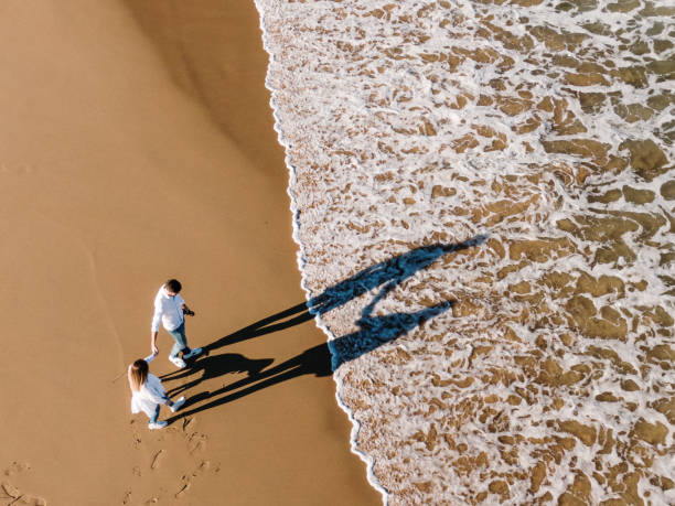 istock Young couple at beach as seen from above 1155233479