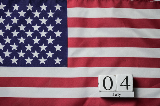 United states flag and wooden calendar,  4th of July background concept