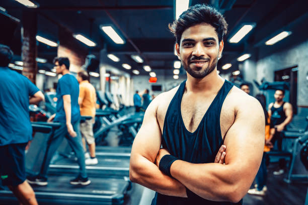 Fitness Instructor Standing at a Fitness Centre and Smiling at the Camera stock photo
