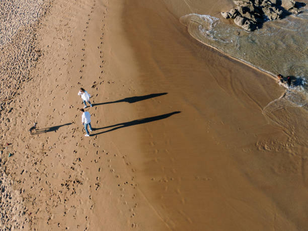 istock Young couple at beach as seen from above 1155234624