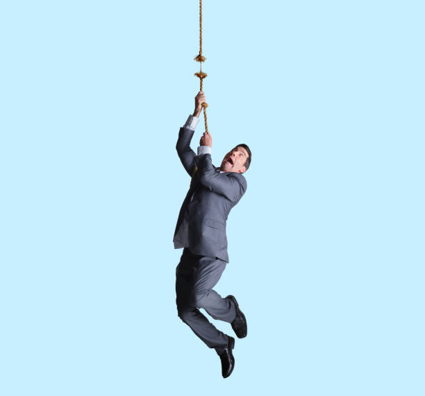 istock Businessman Hanging From Frayed Rope 1155235721