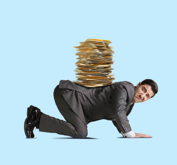 istock Businessman On All Fours With  Stack Of Documents On His Back 1155235727