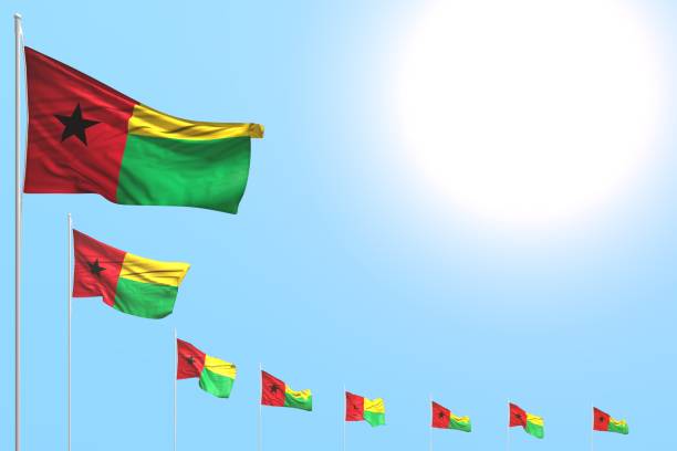 istock cute any feast flag 3d illustration
 - many Guinea-Bissau flags placed diagonal on blue sky with space for content 1155236258