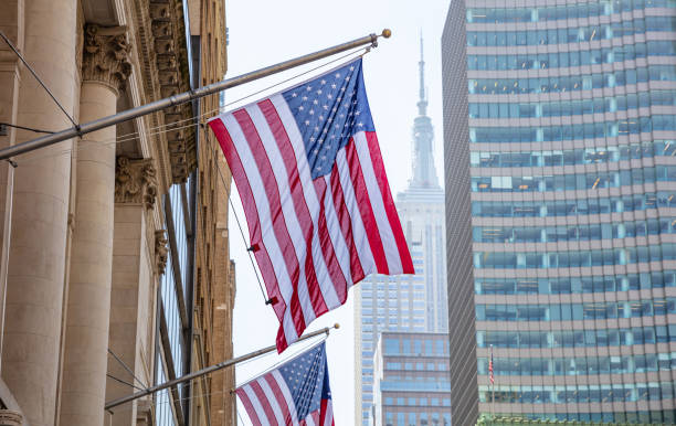 istock American flag, Manhattan downtown, blur Empire state building on the background 1155237836