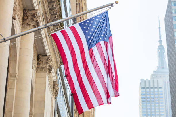 istock American flag, Manhattan downtown, blur Empire state building on the background 1155237841