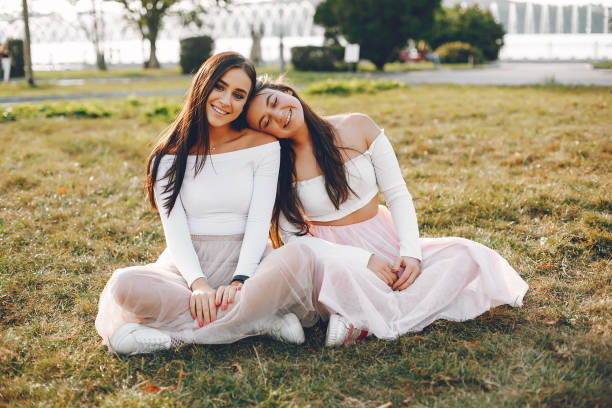 istock Two pretty girls in a summer park 1155239641