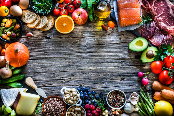 豊富な種類の食品で満たされたテーブル - nut directly above multi colored food ストックフォトと画像