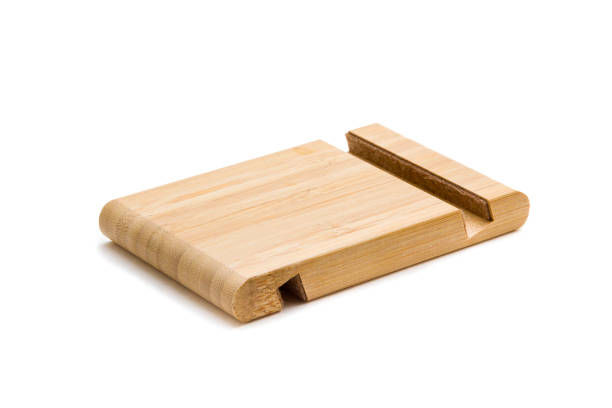 istock Wooden stand for smartphone isolated on white 1155240534