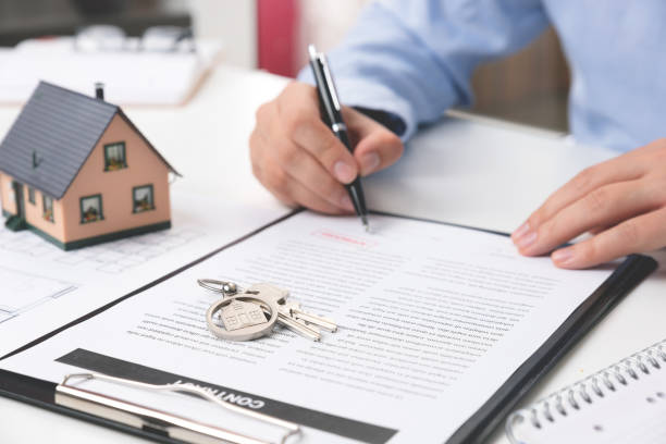 istock Real estate agent with home keys 1155244385
