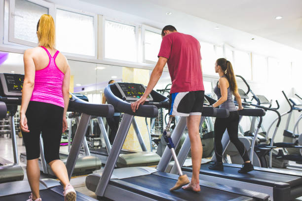 istock Man with prosthetic leg in the gym 1155248255