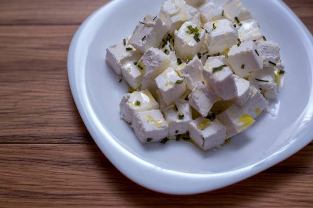 istock Fresh Feta Cheese (detailed close-up shot) on vintage background 1155248802