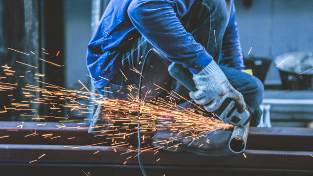 istock Men are cutting steel using electric tools and wearing head protection suits. 1155251056