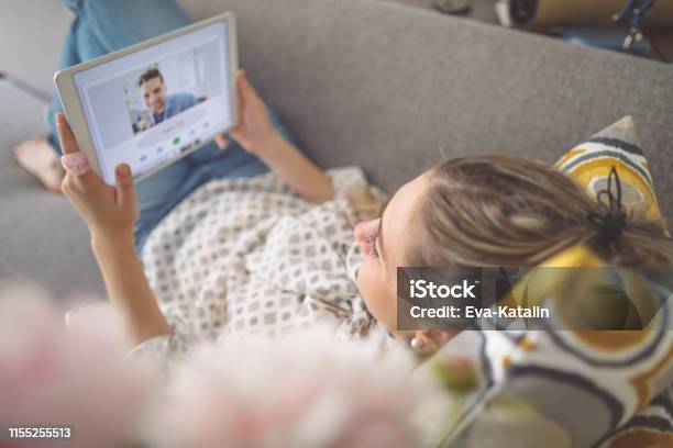 Young Woman Working At Home Stock Photo - Download Image Now - Long-Distance Relationship, Video Call, Digital Tablet