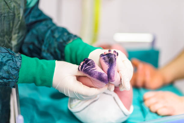 istock baby just born with navel cord 1155256978