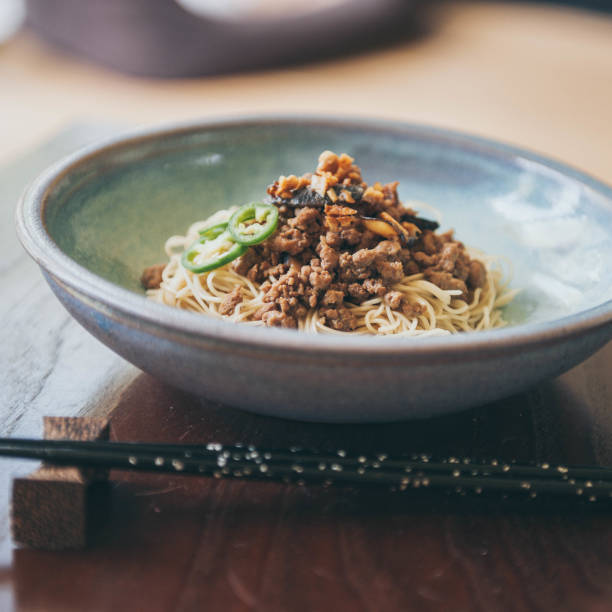 istock Egg noodles with minced pork and shiitake mushroom 1155257466