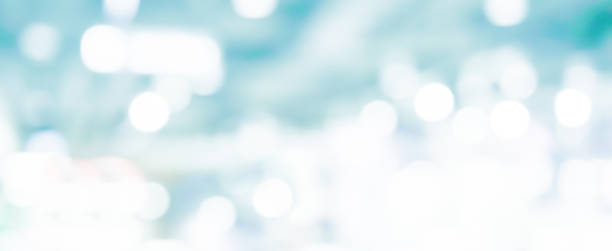 istock abstract blur soft focus blue color modern workplace background with shine light for design concept 1155257659