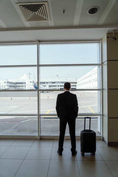 istock Businessman in airport 1155259032