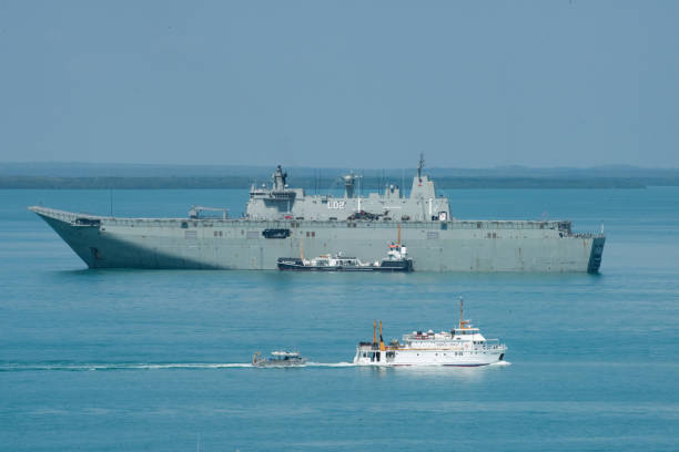 Navy and Pearling Boat Darwin, Northern Territory, Australia-September 2, 2018: Naval vessels in the Timor Sea with Paspaley Pearls Clare II boat off the coast of Darwin, Australia darwin nt stock pictures, royalty-free photos & images