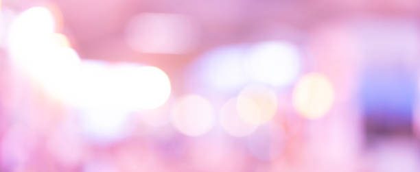istock abstract blur beautiful violet colorful with luxury bokeh bulbs light panoramic background in gala event  for design as banner template concept 1155260175