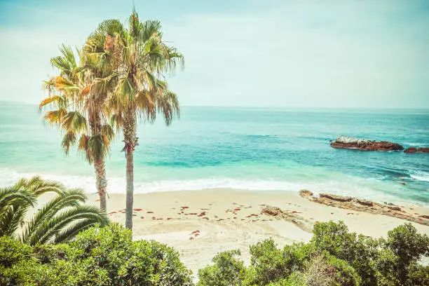 Atmospheric view on the main beach of Laguna Beach in Orange County California retro vintage toned