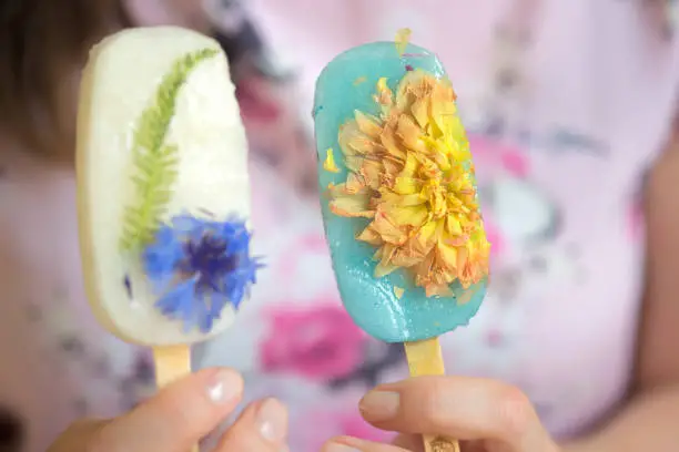Lemon sorbet popsicle with cornflower and  carnelian and Lemon sorbet popsicle (coloured with spirulina) with dahlia