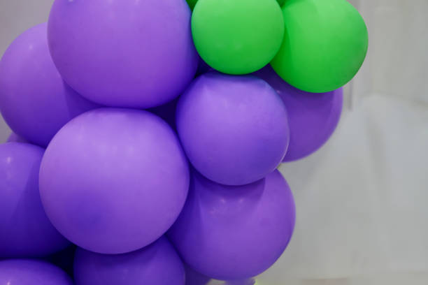 istock Purple balloon and green balloon on white background 1155262959
