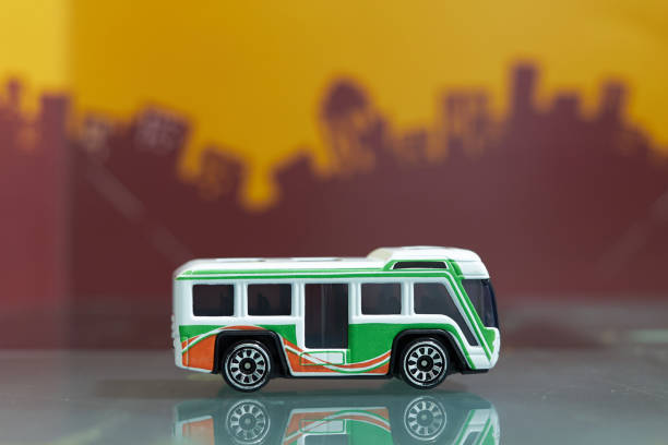 shuttle touring bus toy selective focus on blur city background