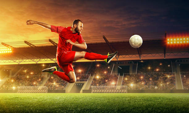istock Soccer player in action on professional soccer stadium. 1155265554