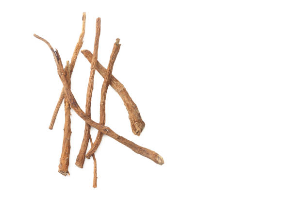 istock licorice roots isolated on white background. top view 1155266429