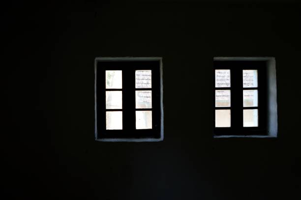istock two small wooden windows in the old house 1155269590