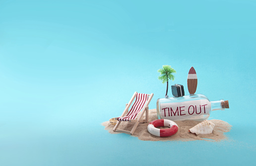 Time out message inside a bottle on sandy island with deck chair, luggage and palm tree